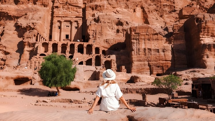 A girl admiring ancient city of Petra in Jordan